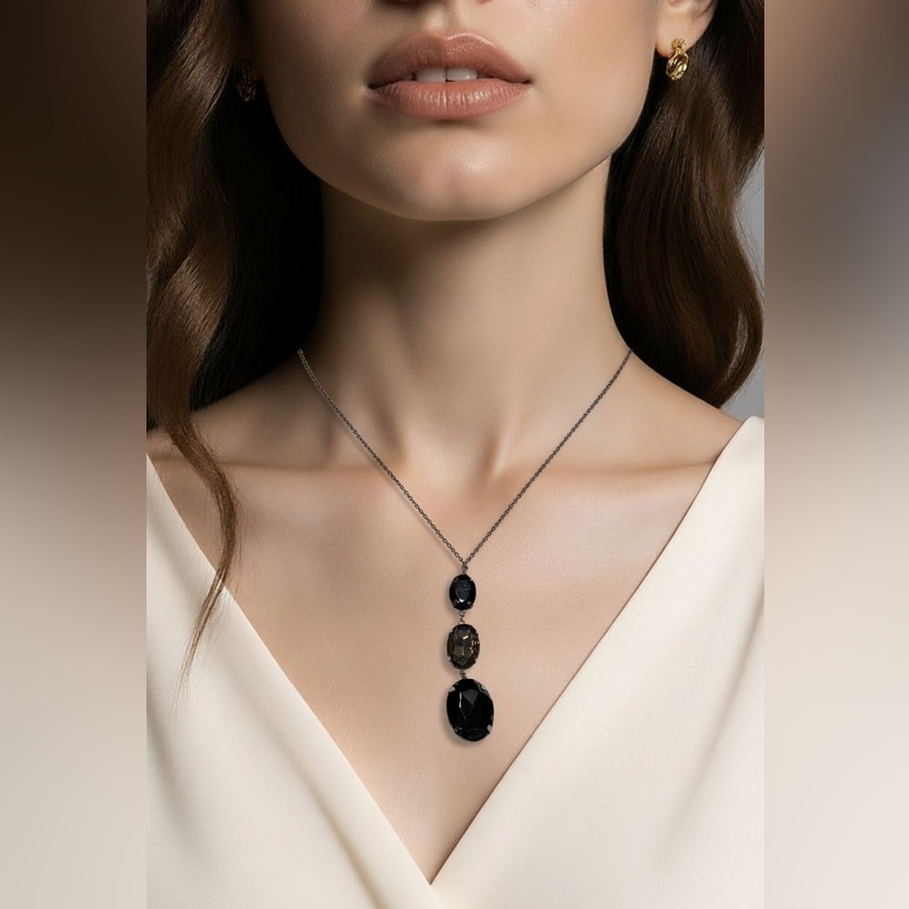 Black necklace with 3 large crystal like pendant